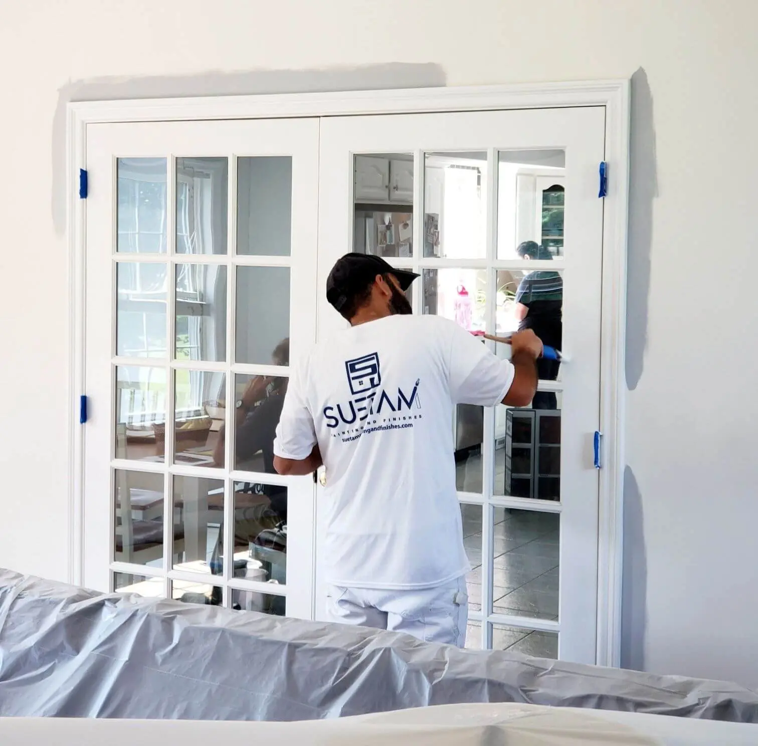 top-rated-local-painters suetam paing team member painting an interior of a home