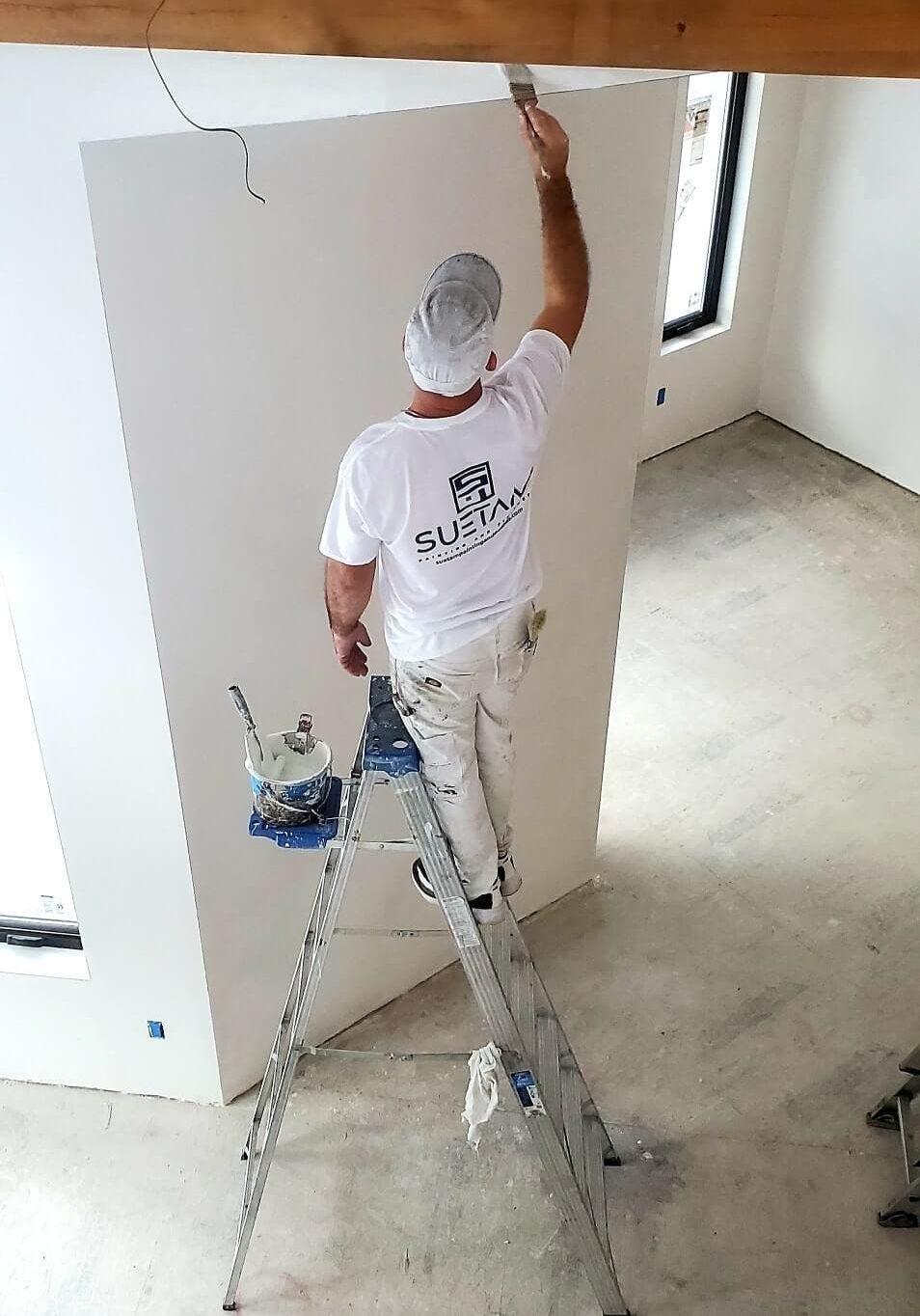 suetam-painting-and-finishes-faqs suetam painting painter working on home interior in andover